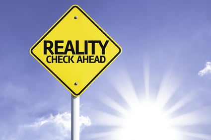 Reality Check Ahead road sign with sun background